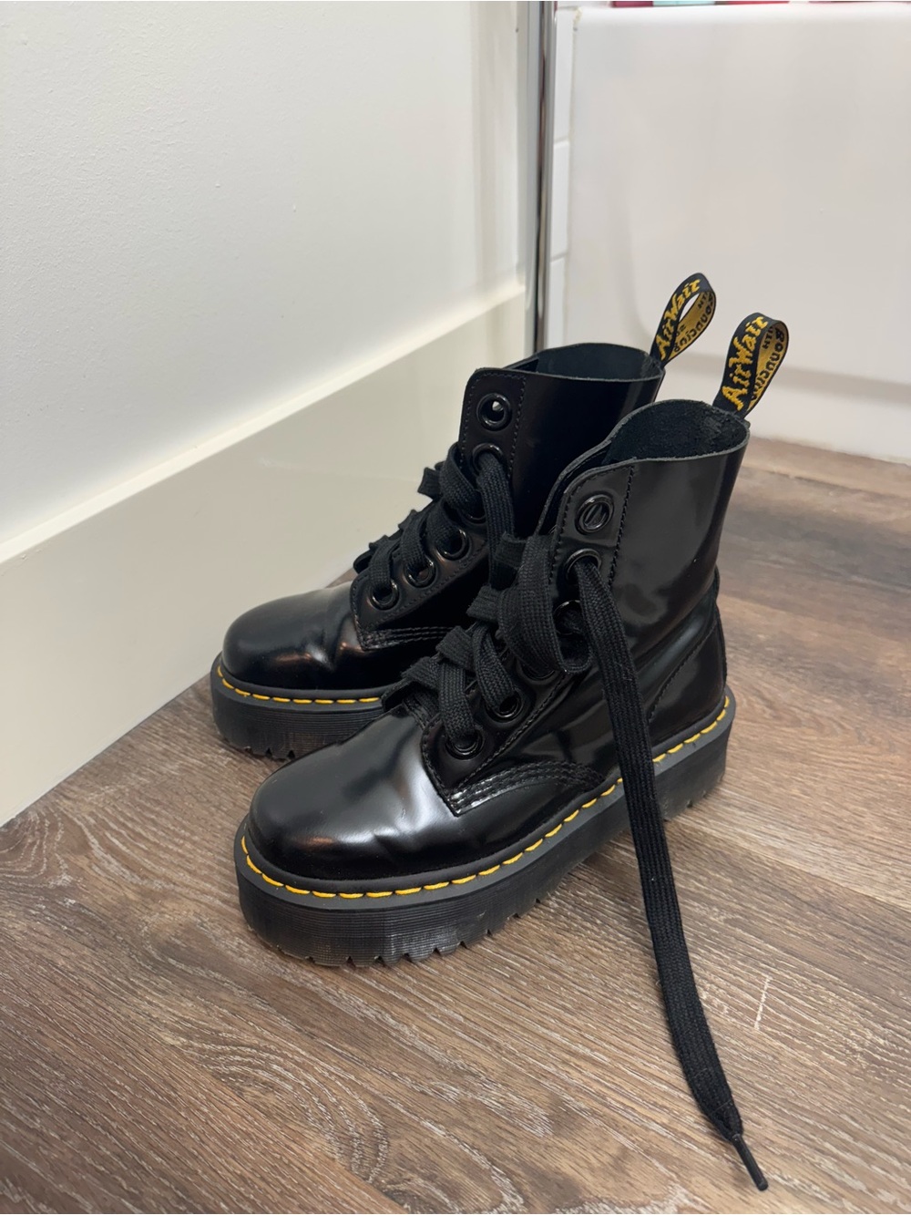 Dr. Martens Black Patent Platform Lace-Up Boots with Yellow Stitching